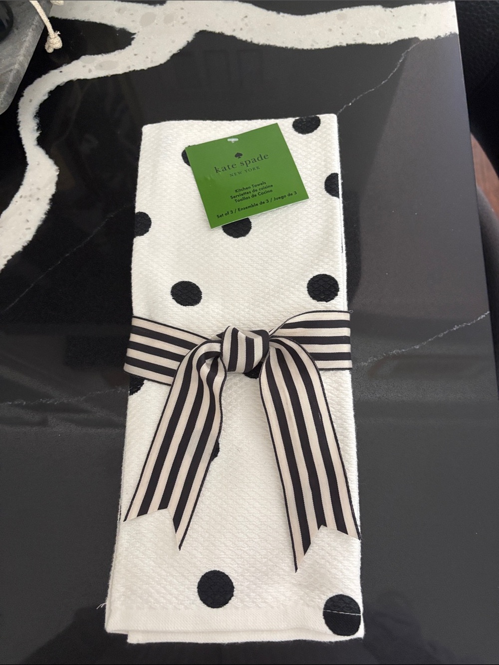 KATE SPADE Three black & white polka dot kitchen towels.